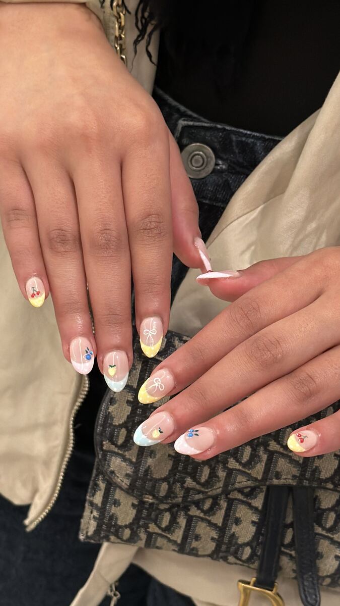 Nude almond nails with pastel hand-painted details