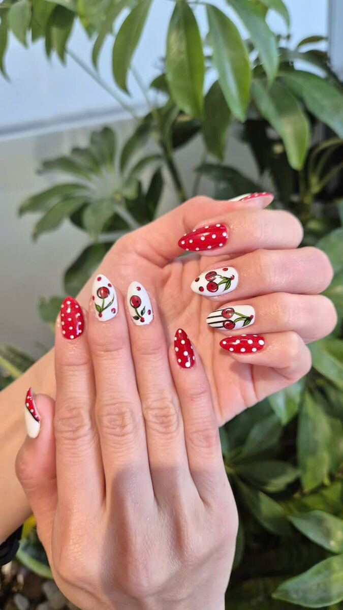 Playful red polka-dot and cherry nail art