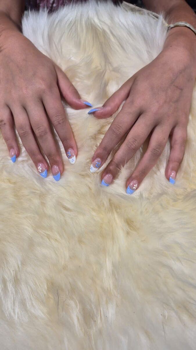 Short natural nails with a baby-blue French tip