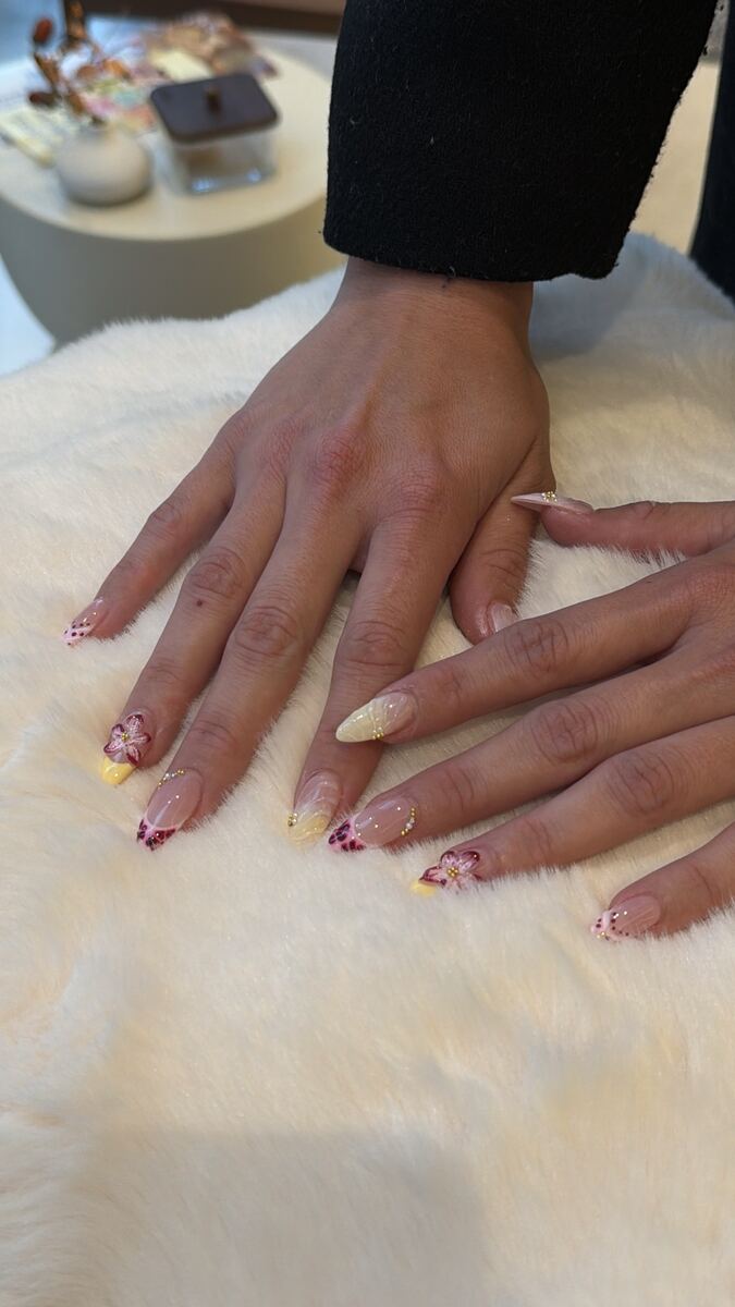 Sheer nude almond nails on a sheepskin rug