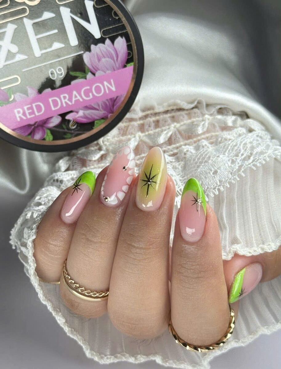 Dip powder nails with green French tips and floral art beside a powder jar