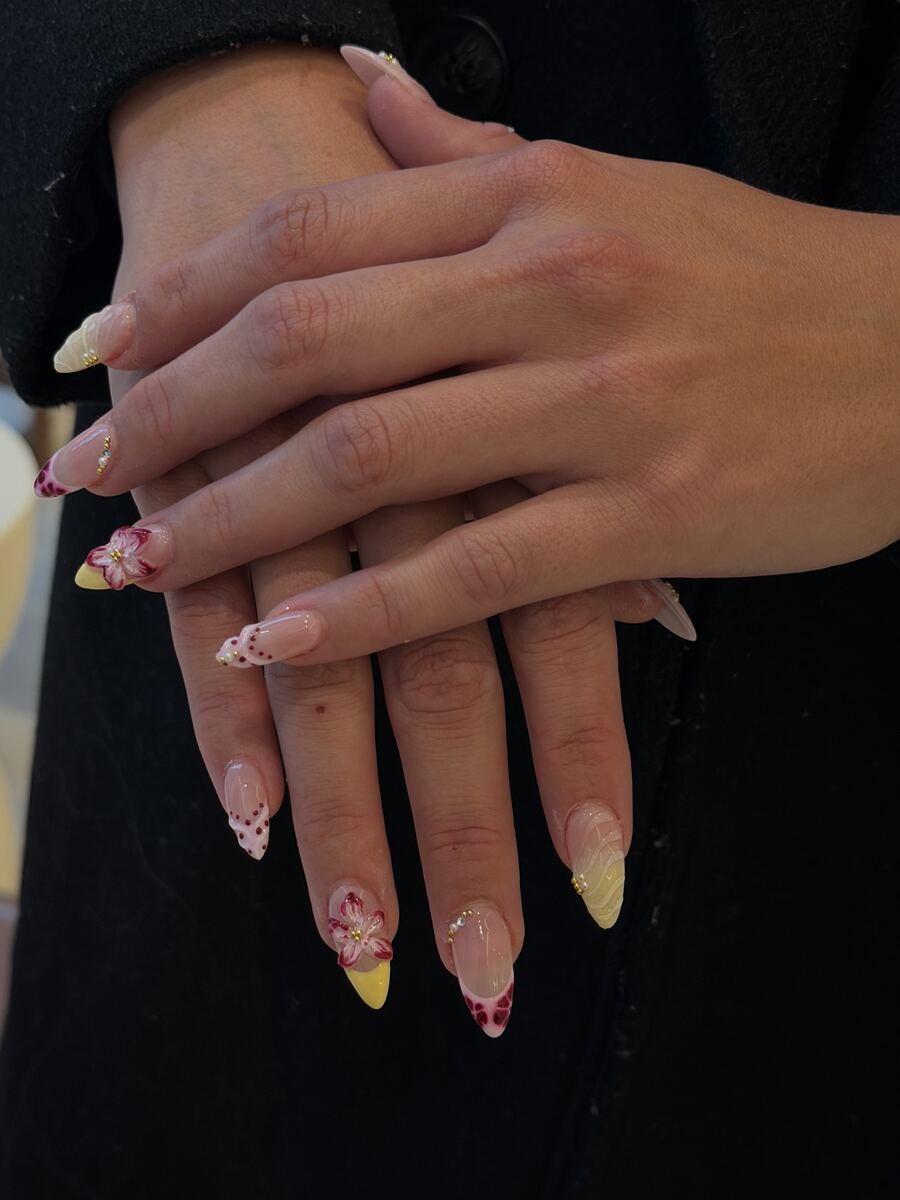 Long stiletto extensions with delicate hand-painted accents
