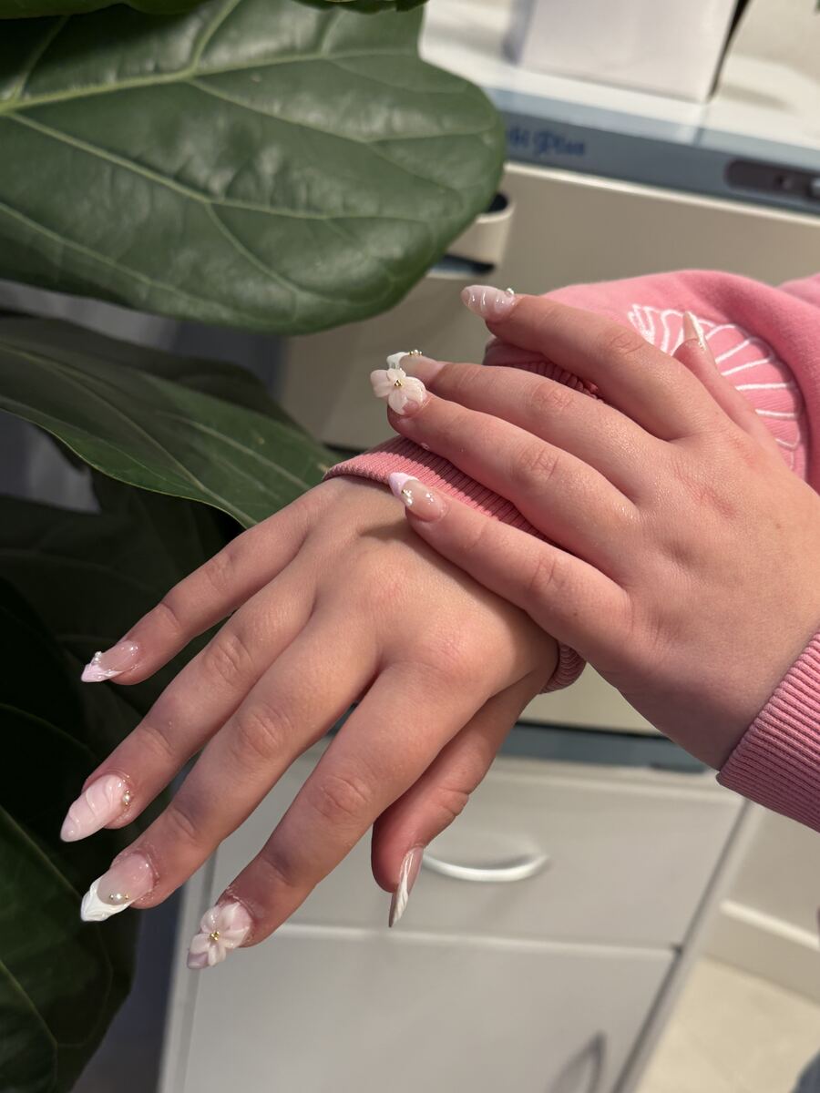 Soft nude manicure with a fine white French tip