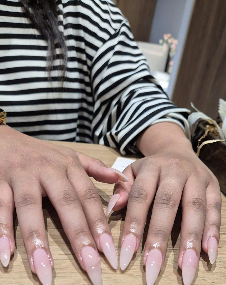 Glossy nude almond manicure