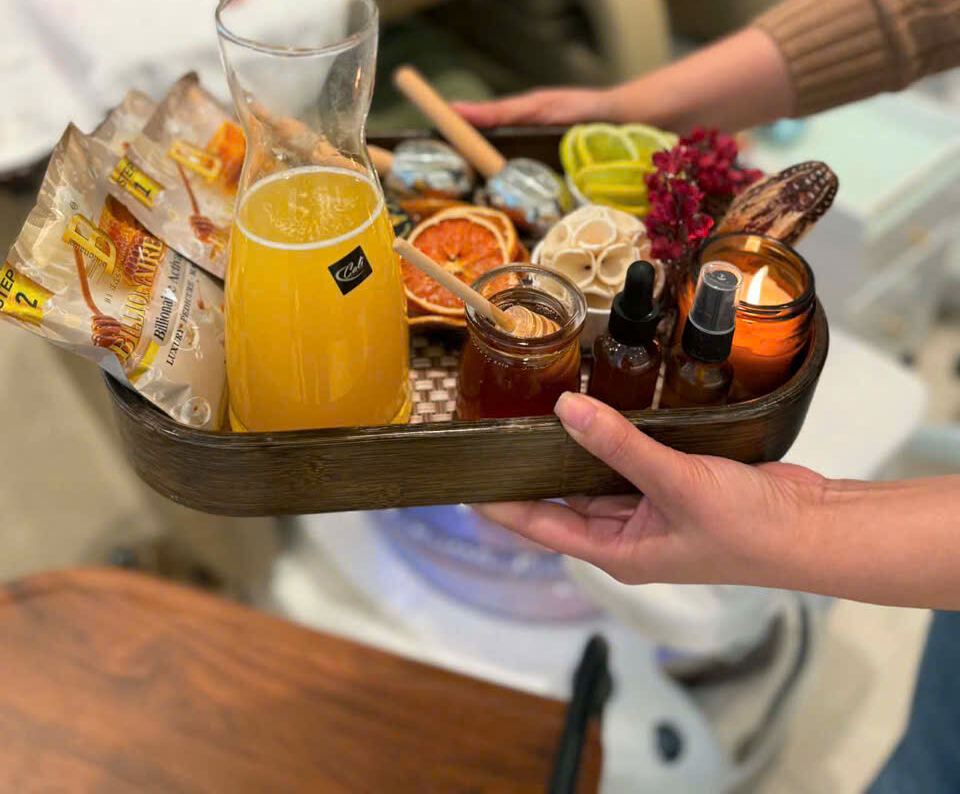Signature pedicure tray served with fresh juice, citrus and herbal scrubs